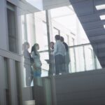 businesspeople-interacting-inside-office-building_107420-74339