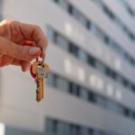hand-holding-keys-outdoors_23-2151015231