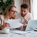 young-professionals-collaborating-project-with-laptop-papers_24972-2888