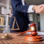Professional,Lawyer,Handshake,In,Business,Meeting,With,Scales,Of,Justice